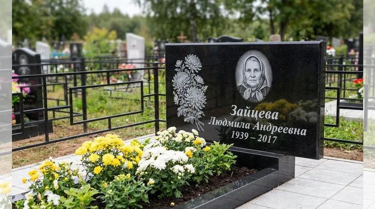 Памятник с гравировкой хризантем — выполненная работа «Зайцева» в Норильске